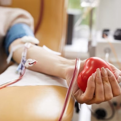 close-up-of-patient-with-tubes-in-her-arm-squeezing-the-ball-in-her-hand-while-donating-the-blood_24